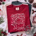 Santa Baby — Santa-baby lettering with a line-drawn Santa face and stars