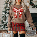Merry Bow — a large red and white striped Christmas bow
